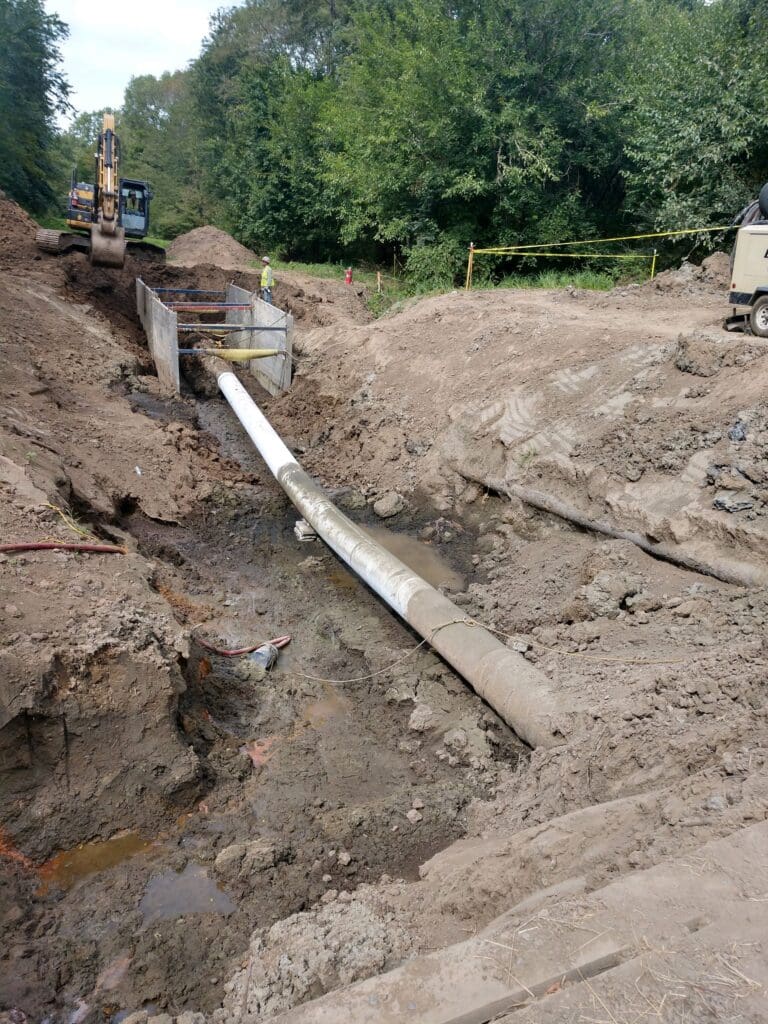 Excavating a pipe for the MP 286.03 Exposure
