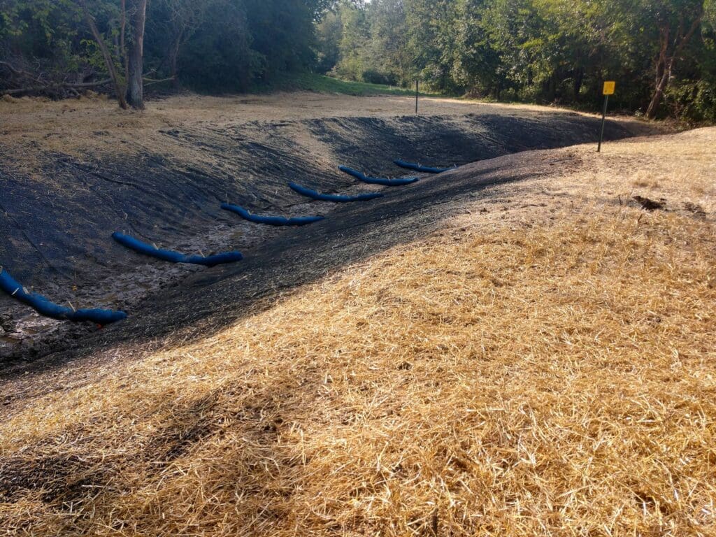 An image of sandbags in a ditch at the MP 286.03 Exposure