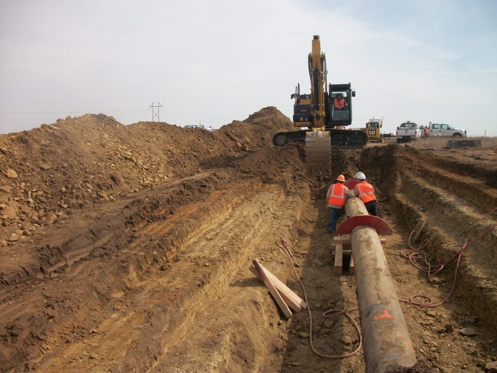 Workers excavating a pipe